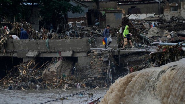 Bắc Kinh và vùng lân cận ngập lụt vì mưa lớn, ít nhất 20 người thiệt mạng ảnh 6